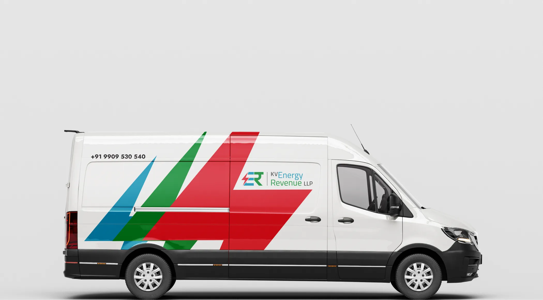 White service van wrapped with KV Energy Revenue LLP branding, featuring large red, green, and blue dynamic graphics, the company logo, and contact phone number.