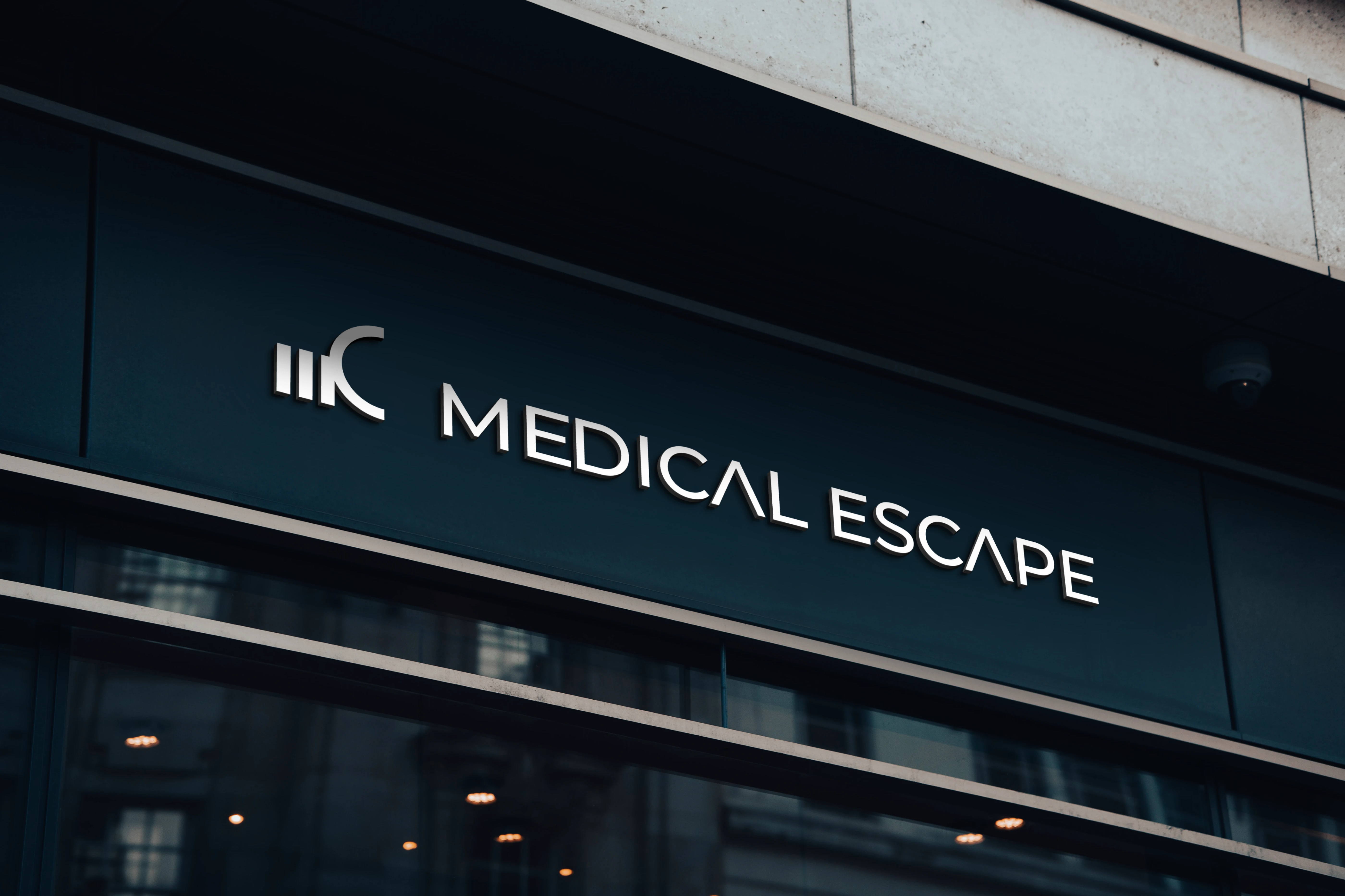 Silver 'MEDICAL ESCAPE' lettering and logo installed on a modern dark storefront sign.