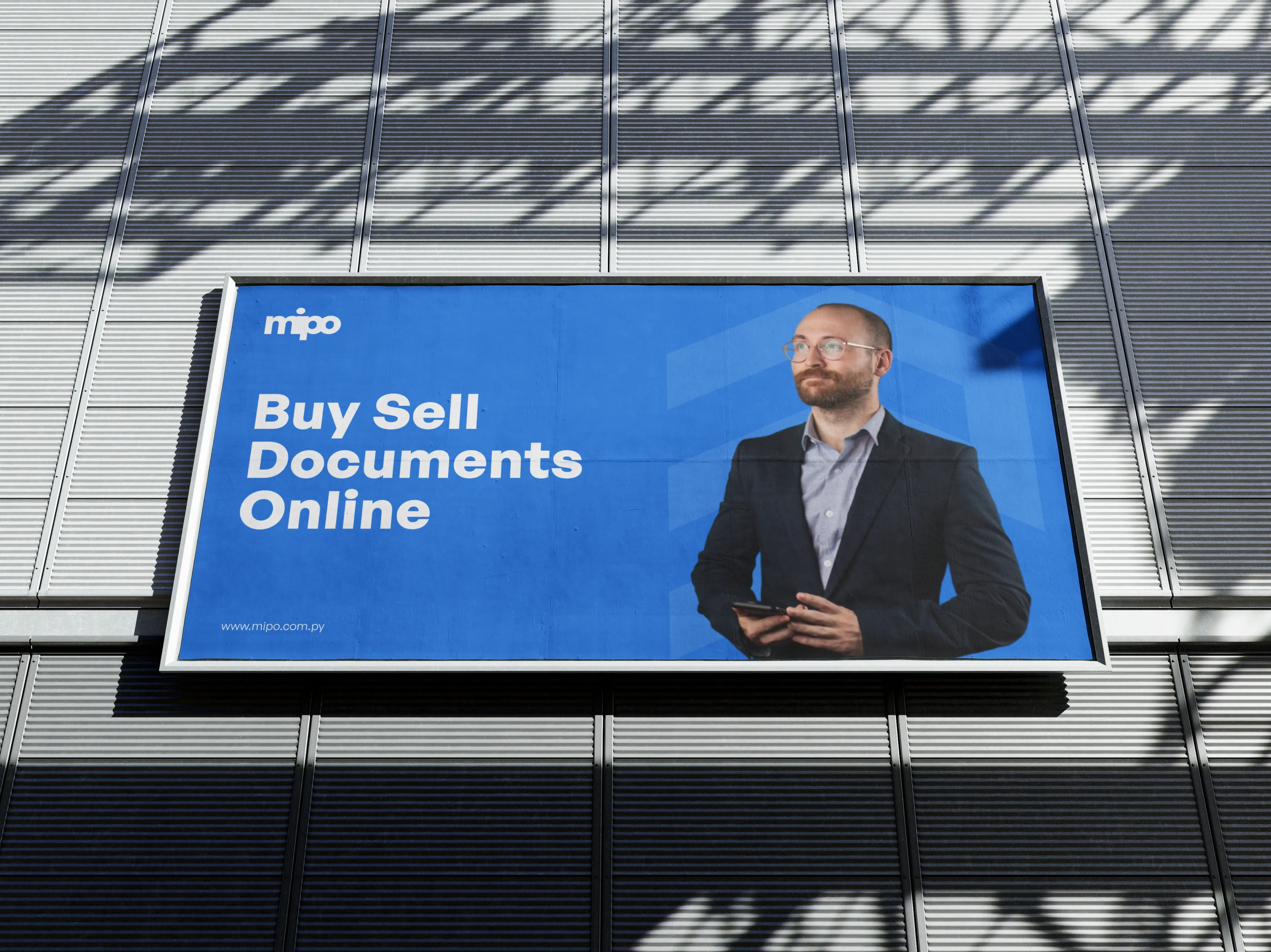 Outdoor billboard advertisement on a textured gray wall reading 'Buy Sell Documents Online' with Mipo logo.