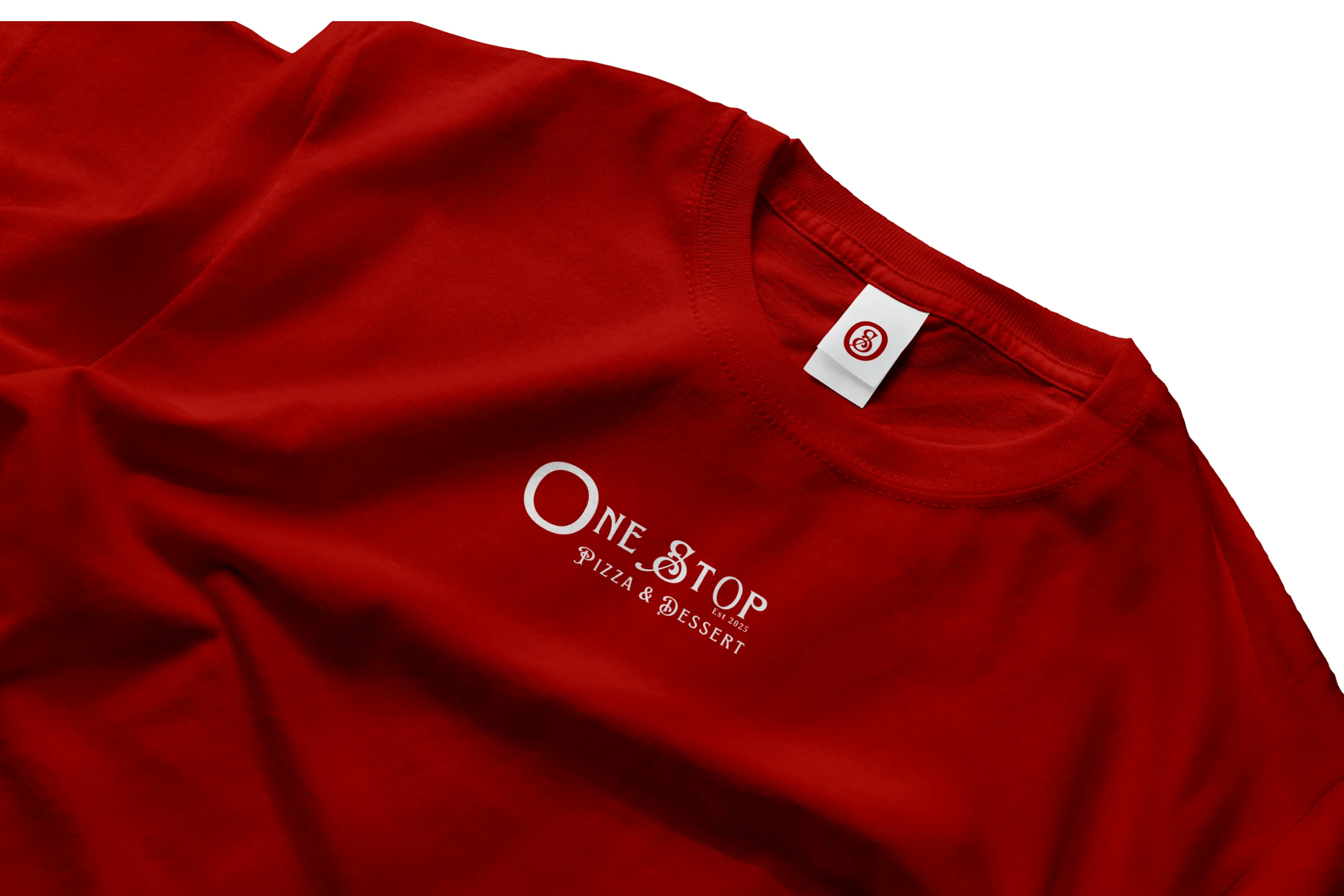 A folded red t-shirt featuring the white One Stop Pizza & Dessert logo embroidered on the chest.