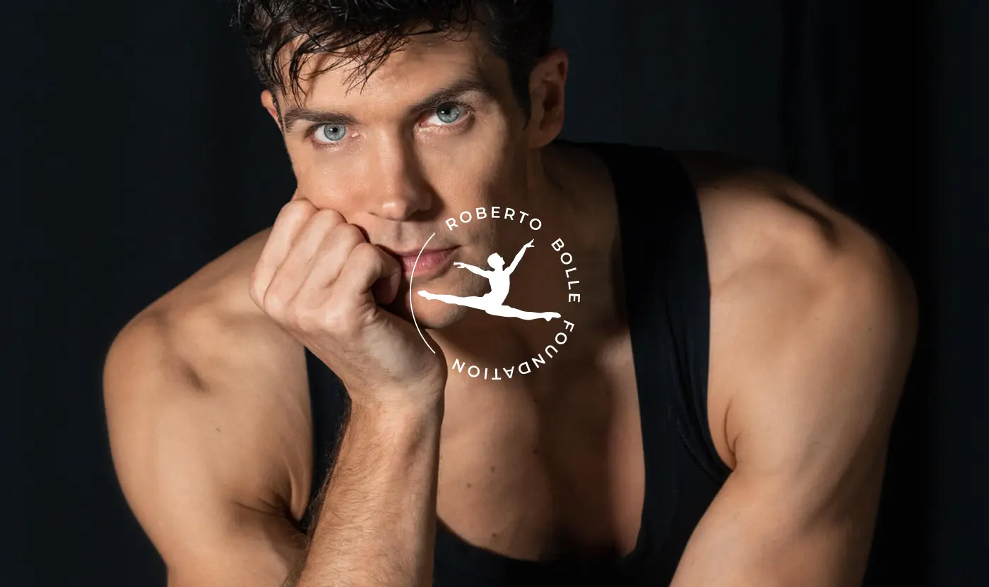 Close-up portrait of Roberto Bolle with the circular foundation logo overlaid on the center.